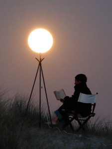 "Sabine is reading, lighting by the Moon"