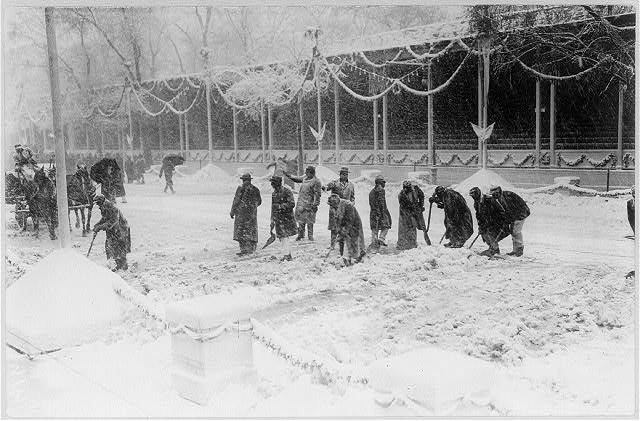 William Howard Taft, 1857-1930; workmen clearing snow in front of reviewing stand at White House on Inauguration Day, March 4, 1909