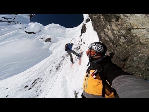 Watch This GoPro Video of a Snowboarder Rappelling a Rocky Cliff