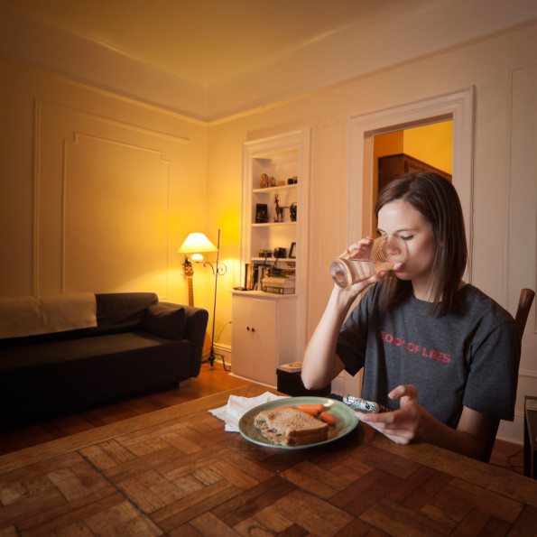 Chelsea Olson, a model concentrates on her food while reviewing her busy day. Age: 20  Time: 8:13 PM Location: Windsor Terrace, Brooklyn
