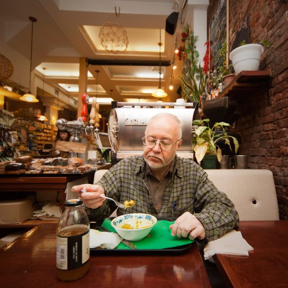 Richard Phillip Nelson, who works in several restaurants, eats dinner during his break at an organic cafe in Earthmatters. He is an organic vegan and comes to this cafe a few times in a week. Age: 59, Time: 5:58 PM Location: Lower East Side, New York