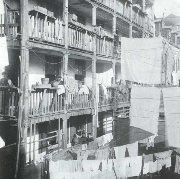 "An old rear tenement in Roosevelt Street"