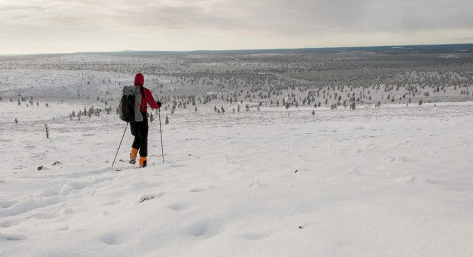 Backpacker in winter landscape
