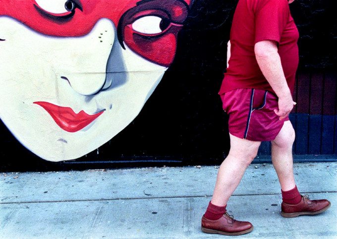 A man walks out of a local Seattle bar in the early morning hours and pasts by a mural outside a the Speakeasy Cafe. ©The Seattle Times/Thomas James Hurst 2000