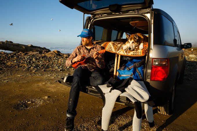 Ben Moon and his dog Denali relaxing on the Oregon coast while waiting for the surf to clean up.
