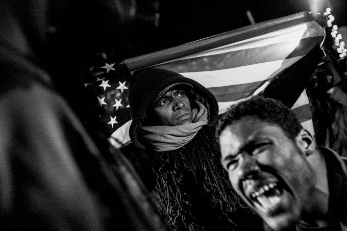 rotestors demonstrate outside of the Ferguson Police Station the day after the decision not to indict officer Darren Wilson on November 25, 2014 in Ferguson, MO. Brown, 18, a black teenager, was shot and killed by Ferguson Police Department Officer Darren Wilson, creating unrest in the city. (Andrew Renneisen/Getty Images Reportage)