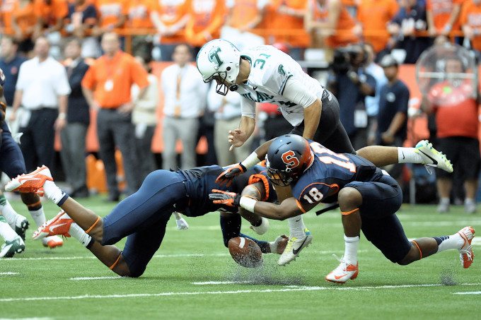 Syracuse Orange safety DURELL ESKRIDGE (3) and Syracuse Orange defensive back DARIUS KELLY (18) block the punt by Tulane Green Wave punter PETER PICERELLI (31) during the first quarter at the Carrier Dome in Syracuse, NY. Syracuse leads Tulane 42-17 at the half.