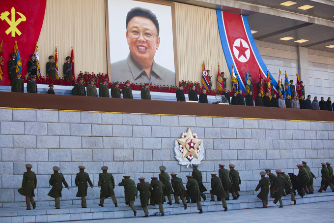 Senior North Korean military members approach an area where new North Korean leader Kim Jong Un and other military and political leaders stand at Kumsusan Memorial Palace in Pyongyang before reviewing a parade of thousands of soldiers and commemorating the 70th birthday of the late Kim Jong Il on Thursday, Feb. 16, 2012.