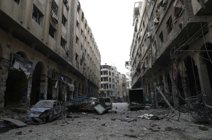 A view of the Syrian town of Douma in the eastern Ghouta region, a rebel stronghold east of the capital Damascus, following air strikes on December 13, 2015. At least 28 civilians were killed in heavy bombardment of the besieged Syrian rebel stronghold, including near a school, according to the Syrian Observatory for Human Rights. AFP PHOTO / SAMEER AL-DOUMY