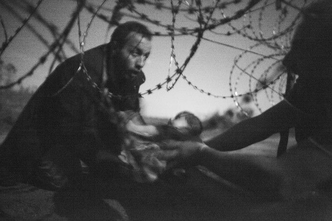 Migrants crossing the border from Serbia into Hungary. World Press Photo Winning Image from Australian photographer Warren Richardson