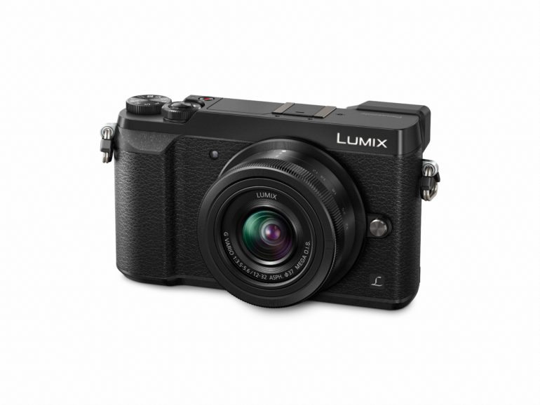 Black Panasonic Lumix digital camera with a zoom lens on a white background.