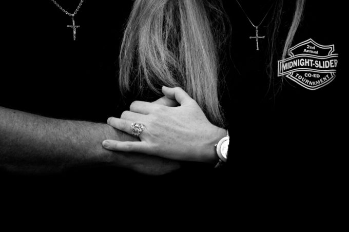 Photo by Christena Dowsett 1st Biker's Church elder Eddy Cook holds hands with wife Becky during a Sunday evening service. Eddy left a life of drugs, cold turkey, after praying that God would take away his desire for such substance.
