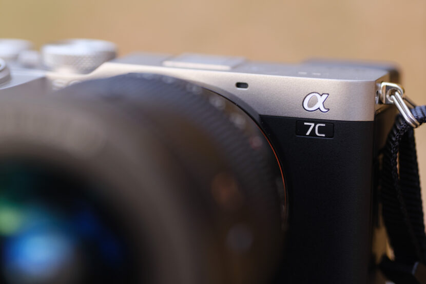 Close-up of a Sony Alpha 7C II camera with lens in focus. Image credit: Hillary Grigonis
