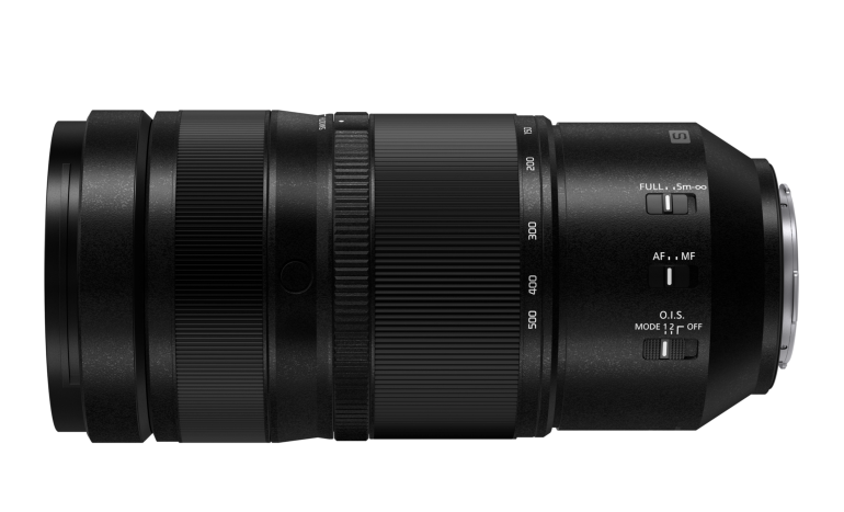 Black camera zoom lens with grip rings and control switches, shown in a side profile on a white background.