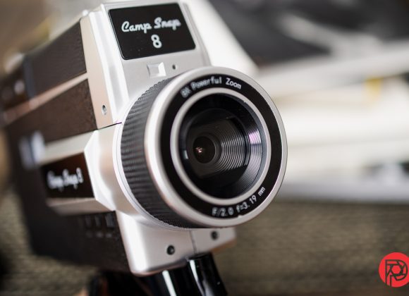 The Most Influential 90s Music Videos for Black and White Photographers Close-up of a vintage Camp Snap 8 video camera with a focused lens and blurred background.