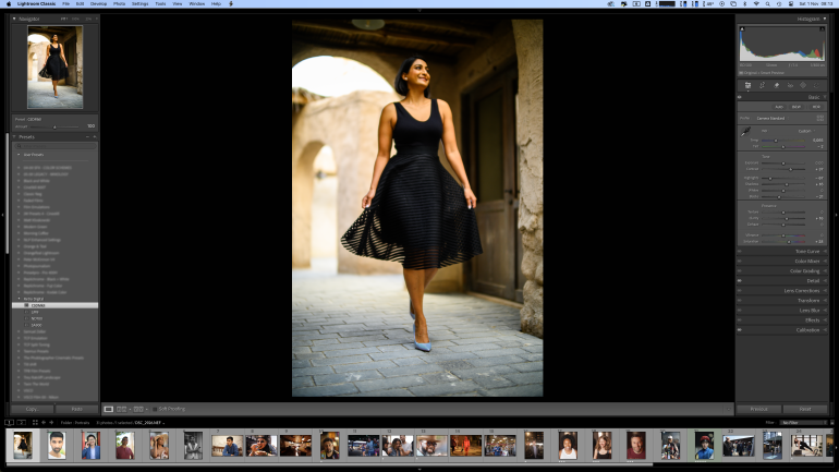 A woman in a black dress walks confidently outdoors, shown on a photo editing software screen.