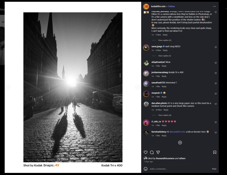 Black and white photo of people walking on a cobblestone street with long shadows at sunset between tall buildings.