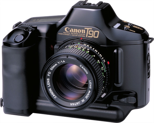 Black Canon T90 film camera with a 50mm lens, shown from a front angled view against a white background.