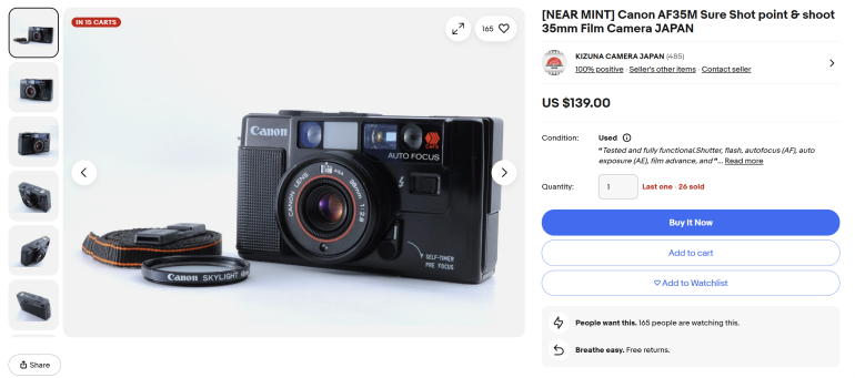 Canon AF35M film camera with lens cap and strap, displayed for sale on an online marketplace listing.