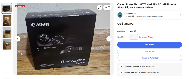 Boxed Canon PowerShot G7 X Mark III camera on a wooden floor, shown in an online listing for $1,159.99.