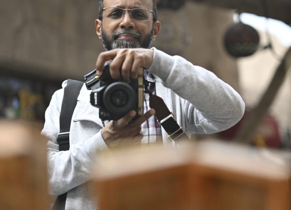 A man holding a camera.