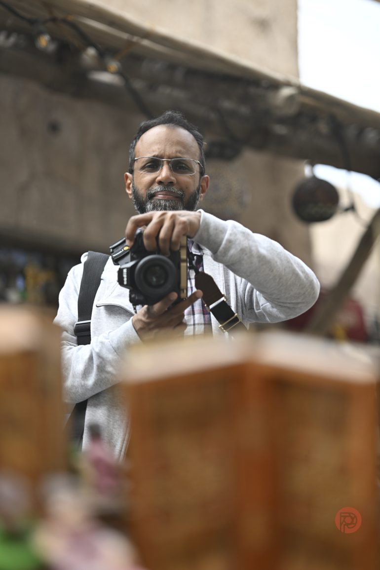 A man holding a camera.