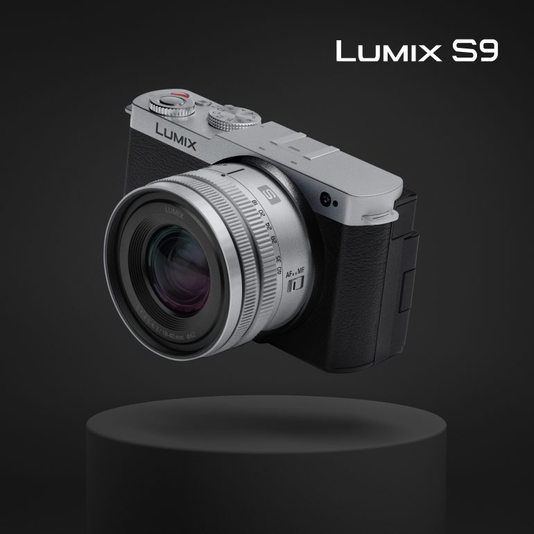 Silver and black Lumix S9 camera floating above a black pedestal, with Lumix S9 text in the corner.
