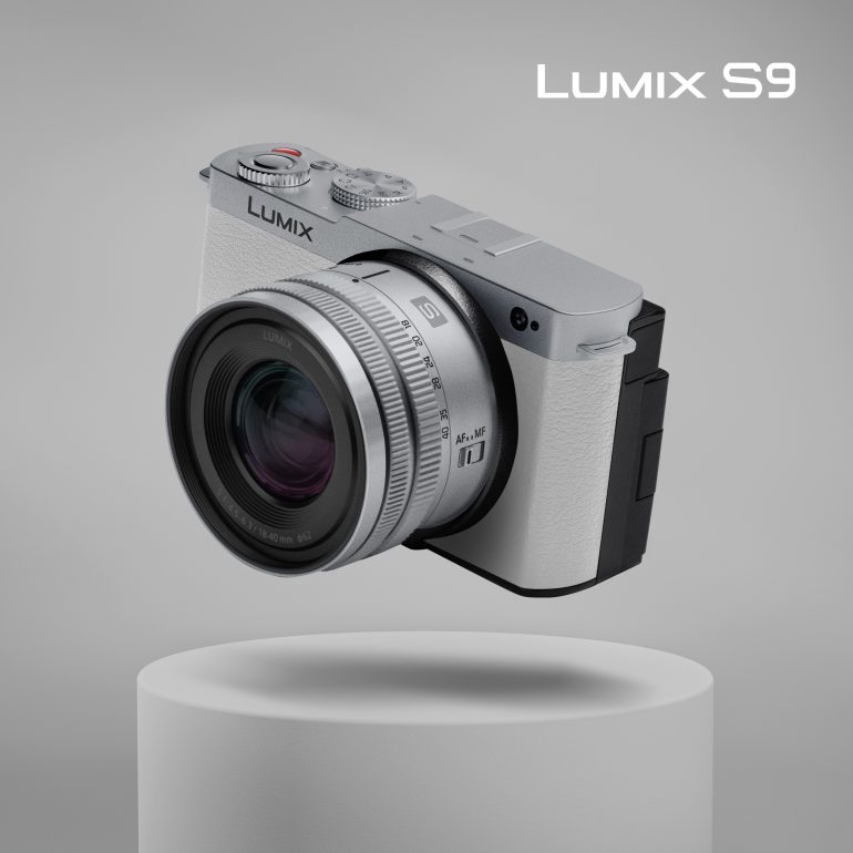Silver Panasonic Lumix S9 camera floating above a white pedestal on a gray background, with text Lumix S9.