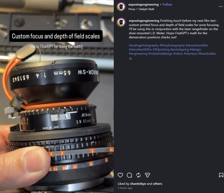 A hand holds a modified camera lens with custom depth of field and focus scales attached.