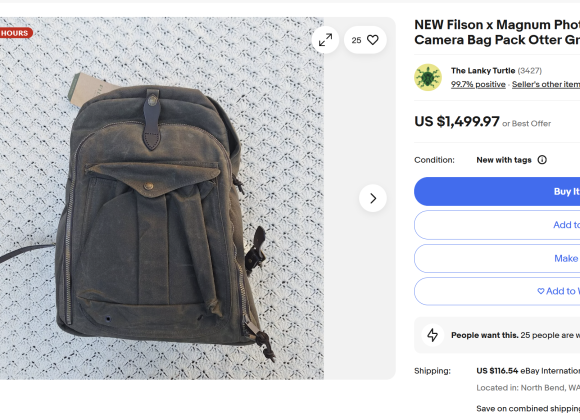 A green Filson x Magnum photographers backpack displayed on a patterned white background on an eBay listing.