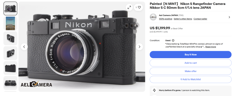 Close-up of a vintage Nikon S rangefinder camera with a 50mm f/1.4 lens on a white background.
