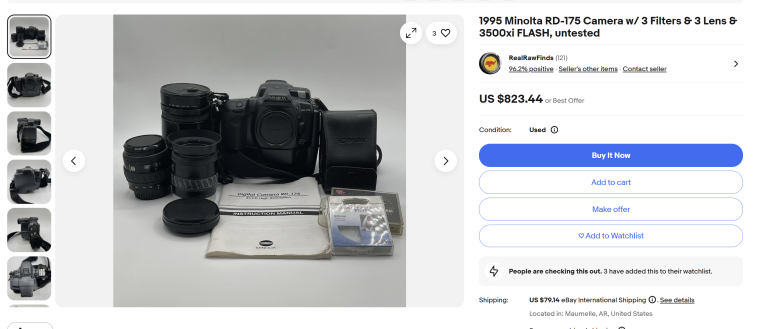 A Minolta RD-175 camera with three lenses, filters, a flash, manual, and accessories on display.