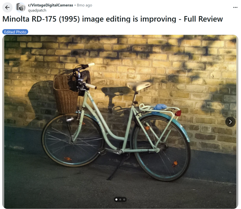 A vintage bicycle with a basket leans against a sunlit brick wall, casting a shadow on the ground.