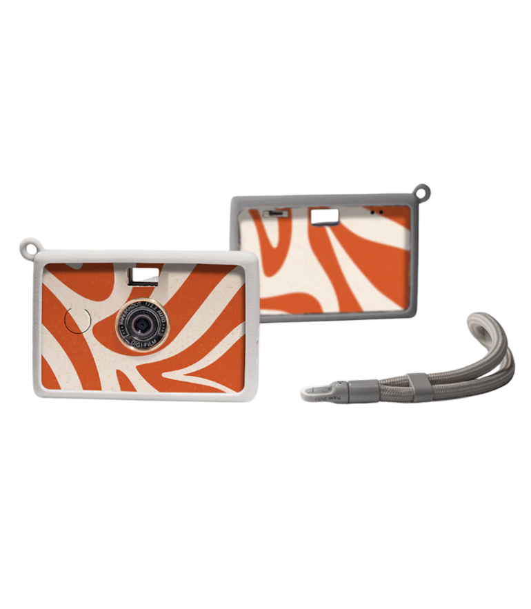 Two retro-style cameras with orange and white abstract patterns, plus a detachable gray wrist strap.