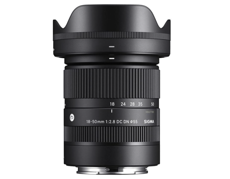 Sigma 18-50mm f/2.8 camera lens with zoom and focus rings, shown against a white background.