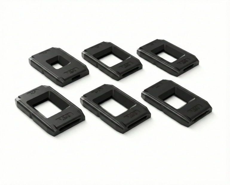 Six black rectangular plastic casings with rectangular cutouts, arranged in two rows on a white background.