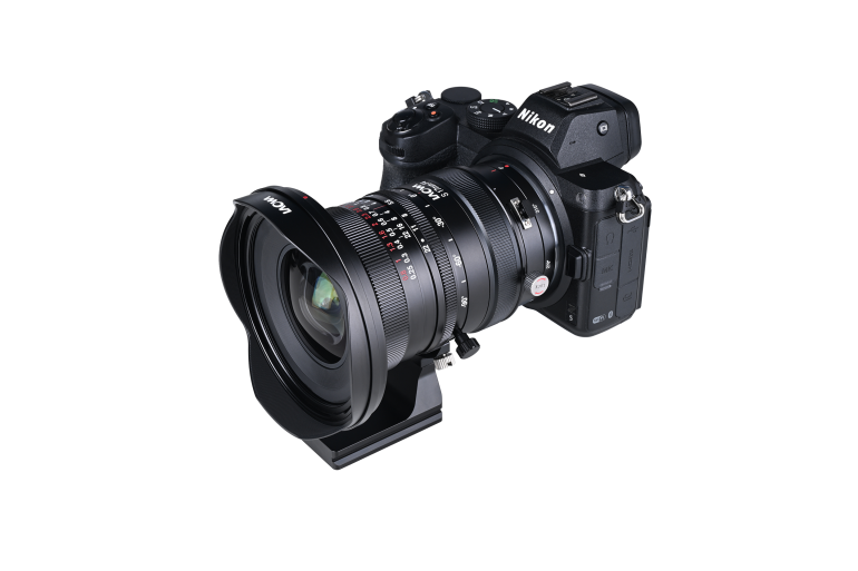 A black Nikon digital camera with a wide-angle lens attached, shown on a white background.