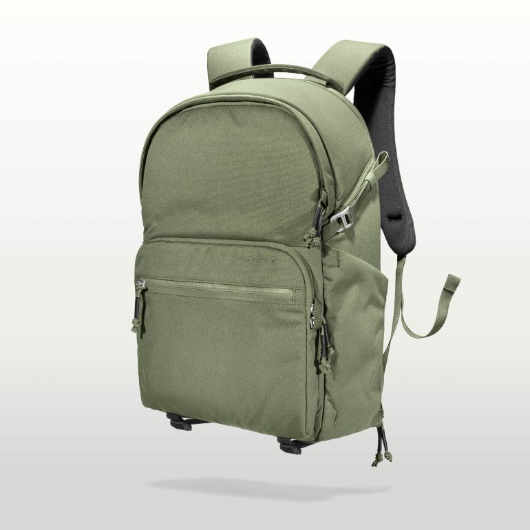 Olive green backpack with multiple zippered compartments and padded shoulder straps, shown on a plain background.