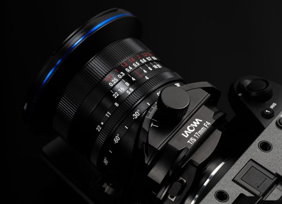 Close-up of a Laowa T/S 17mm F4 camera lens mounted on a camera, photographed against a black background.