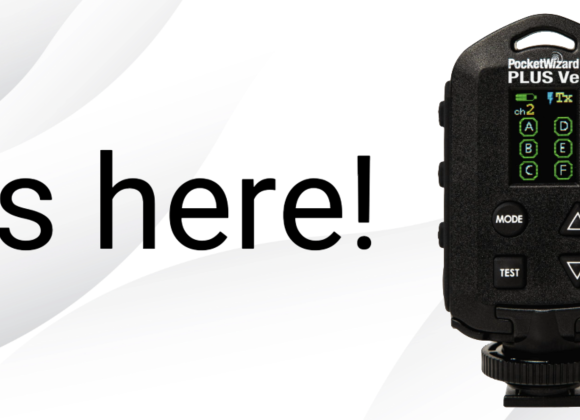 A black PocketWizard PLUS Vee device next to the bold text Its here! on a white background.