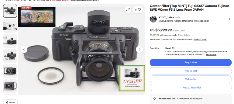 Fujifilm GX617 camera with lens, center filter, case, and accessories displayed on a white background.