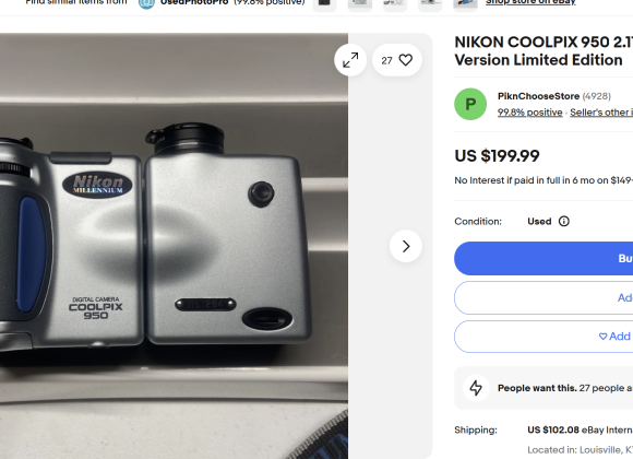 Top view of a silver Nikon Coolpix 950 digital camera displayed on an eBay listing for $199.99.