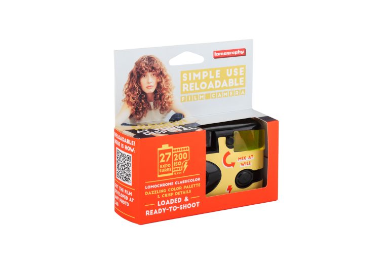 A Lomography simple use reloadable film camera in its packaging with bright red and yellow design elements.