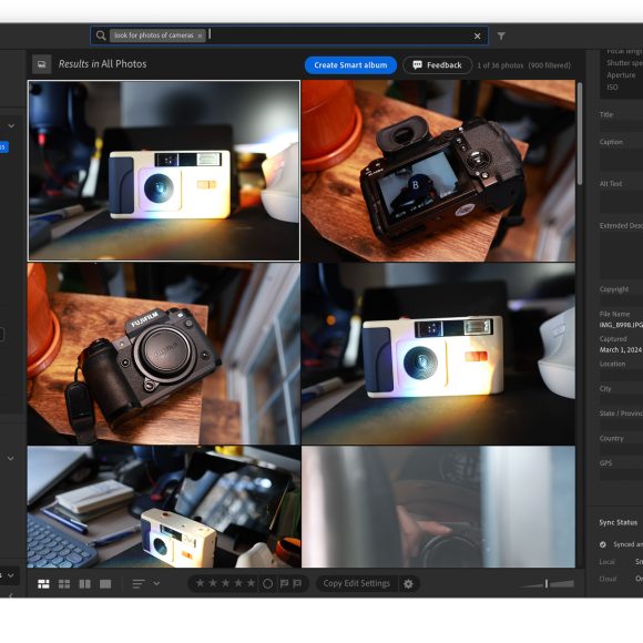 A photo management app window displaying six images of cameras and camera gear on a dark workspace.