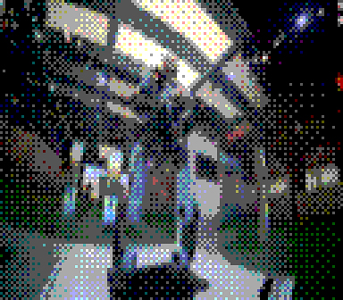 A humanoid robot stands on display inside a modern building with bright overhead lights.