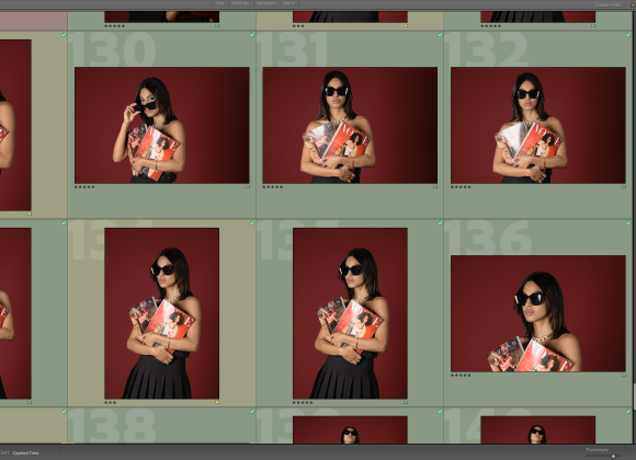 A woman in sunglasses holds a magazine, posing against a red background in a photo editing software interface.
