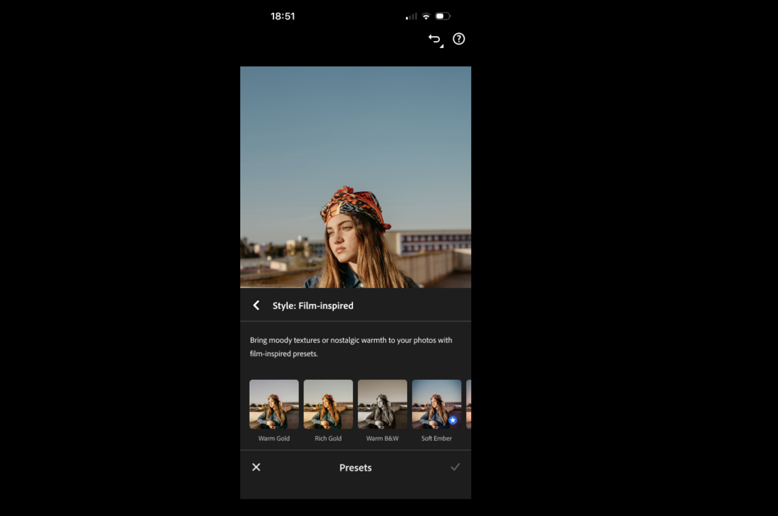 A woman wearing a colorful headscarf is edited with film-inspired photo presets on a mobile editing app.