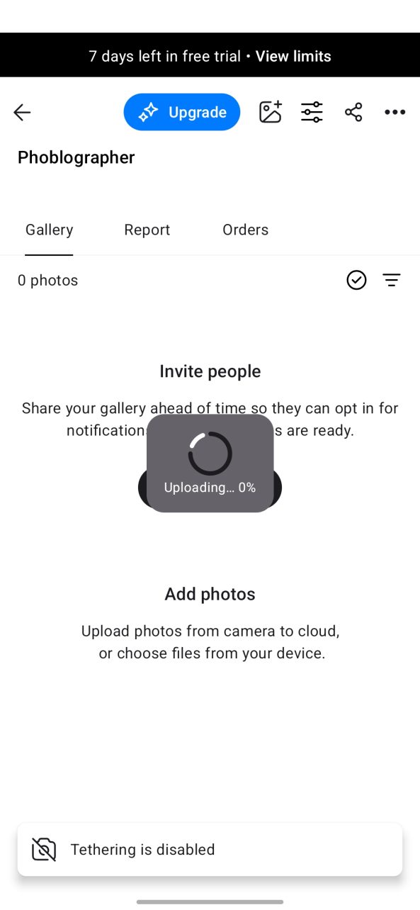 Mobile app screen showing a photo gallery with an upload progress bar at 0% and tethering is disabled.