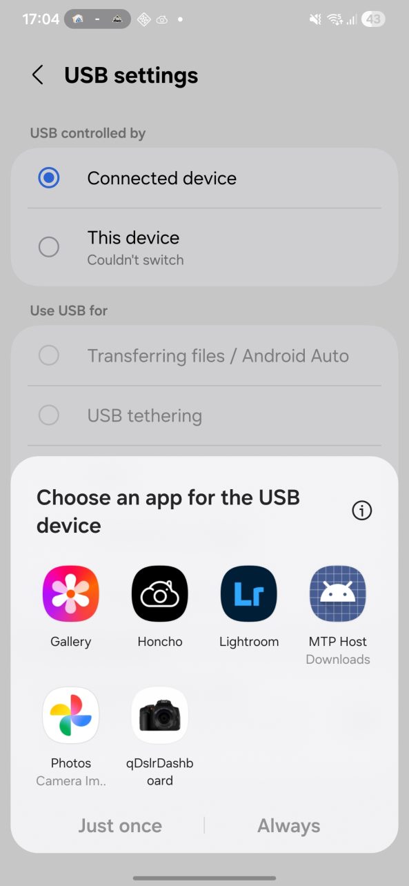 USB settings screen with app selection popup for choosing an app for a connected USB device on a smartphone.