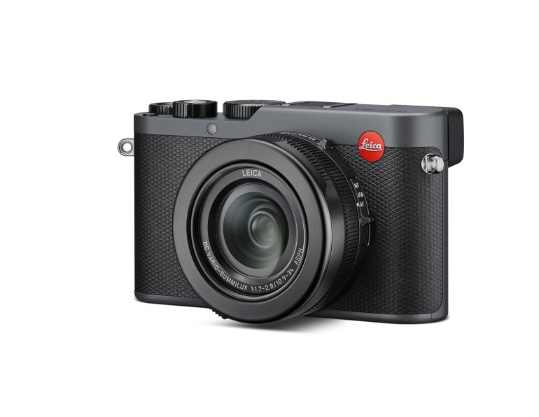 A black Leica digital camera with a large lens and textured grip, viewed from a slight angle.